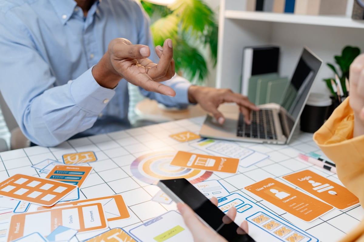 UX designer presenting wireframes and interface layouts in a design workshop